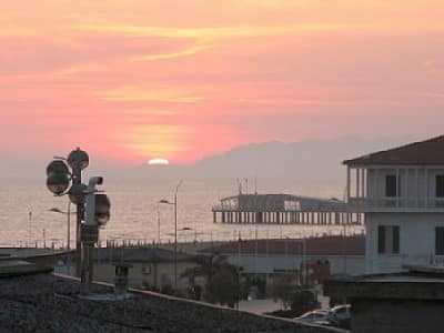 View of sunset on the beach from the terrace of a Viareggio apartment