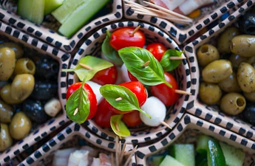 Basil, tomato and mozzarella salad with olive oil dressing 