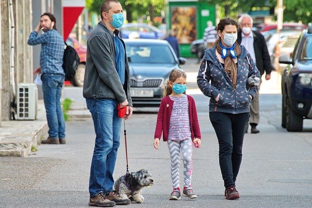 People Wearing Coronavirus Masks with Dog